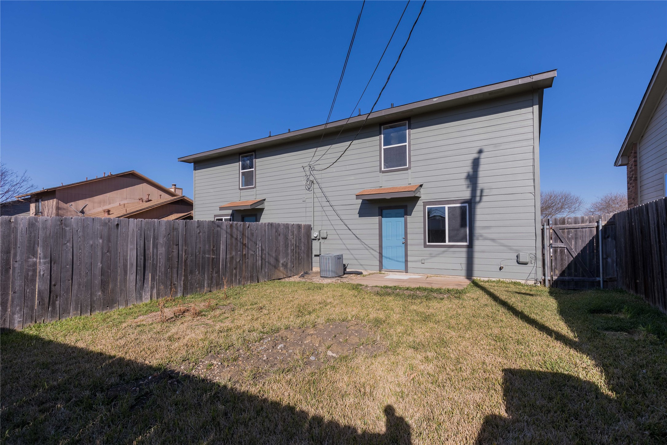 319 Rawhide Loop Round Rock, TX 78681 - Photo 28 of 28 Back of property featuring a patio, a fenced backyard, and a gate
