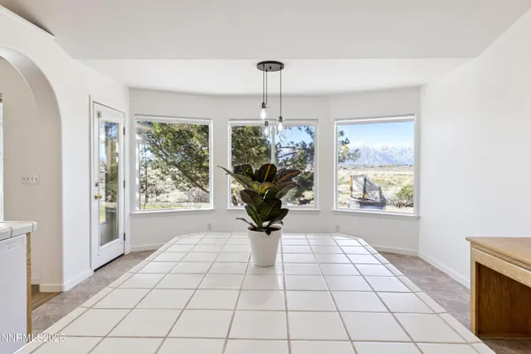 a view of a room with windows and chandelier