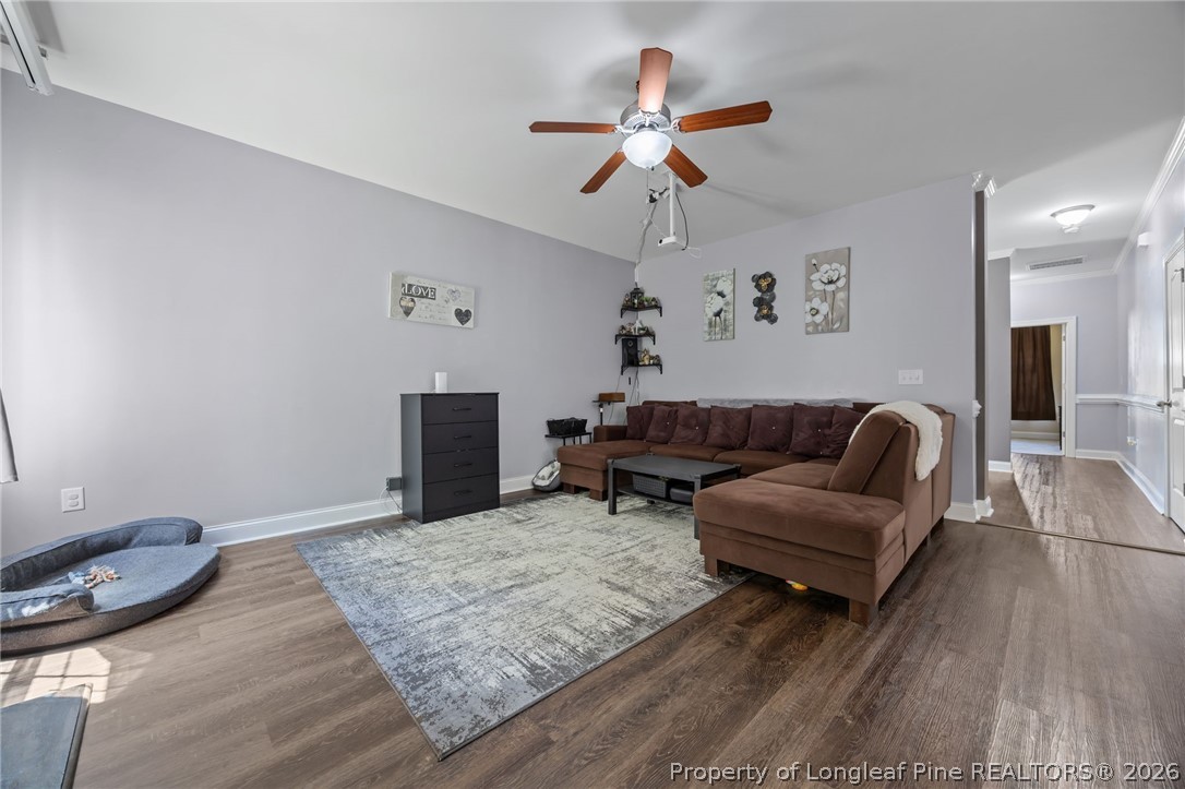 64 Cromwell Circle Cameron, NC 28326 - Photo 12 of 50 a living room with furniture and a wooden floor