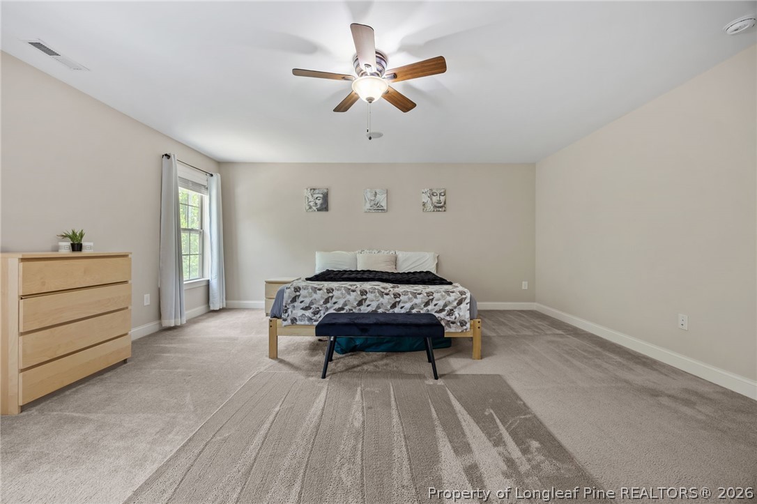 64 Cromwell Circle Cameron, NC 28326 - Photo 21 of 50 a bedroom with a bed and a dresser