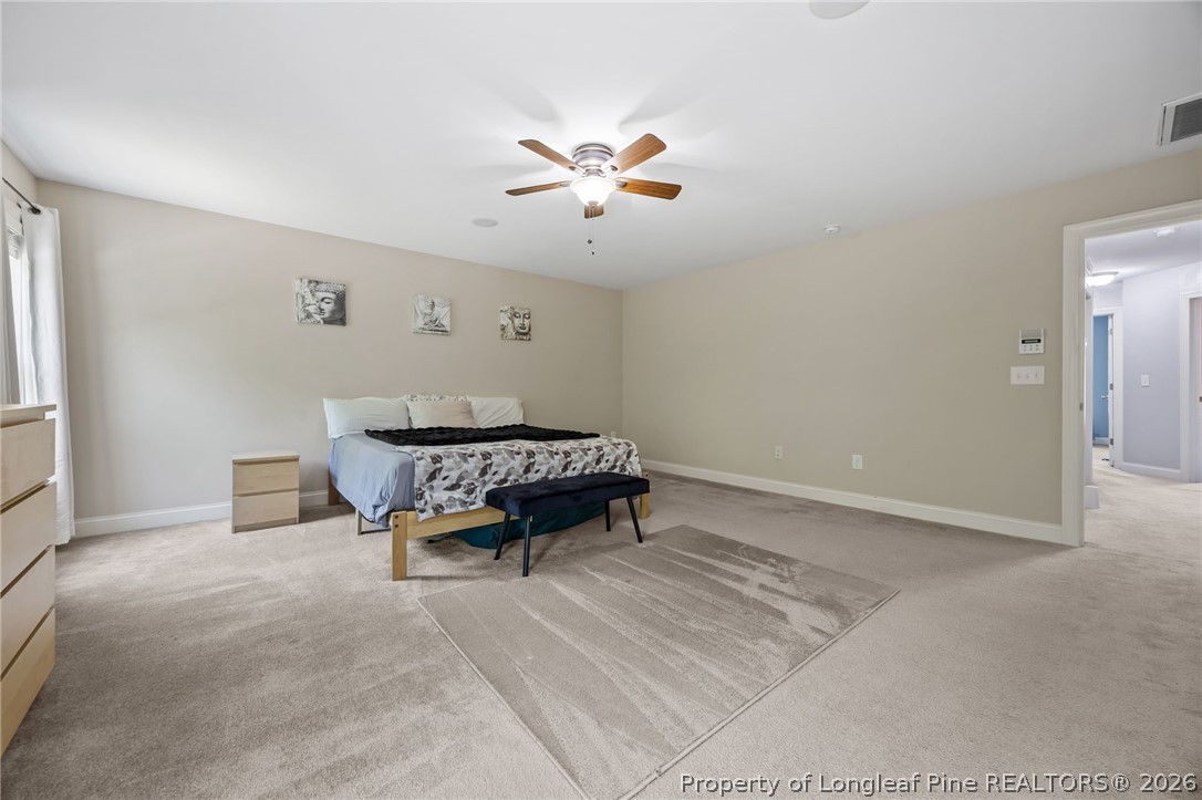 64 Cromwell Circle Cameron, NC 28326 - Photo 22 of 50 a living room with furniture and a ceiling fan