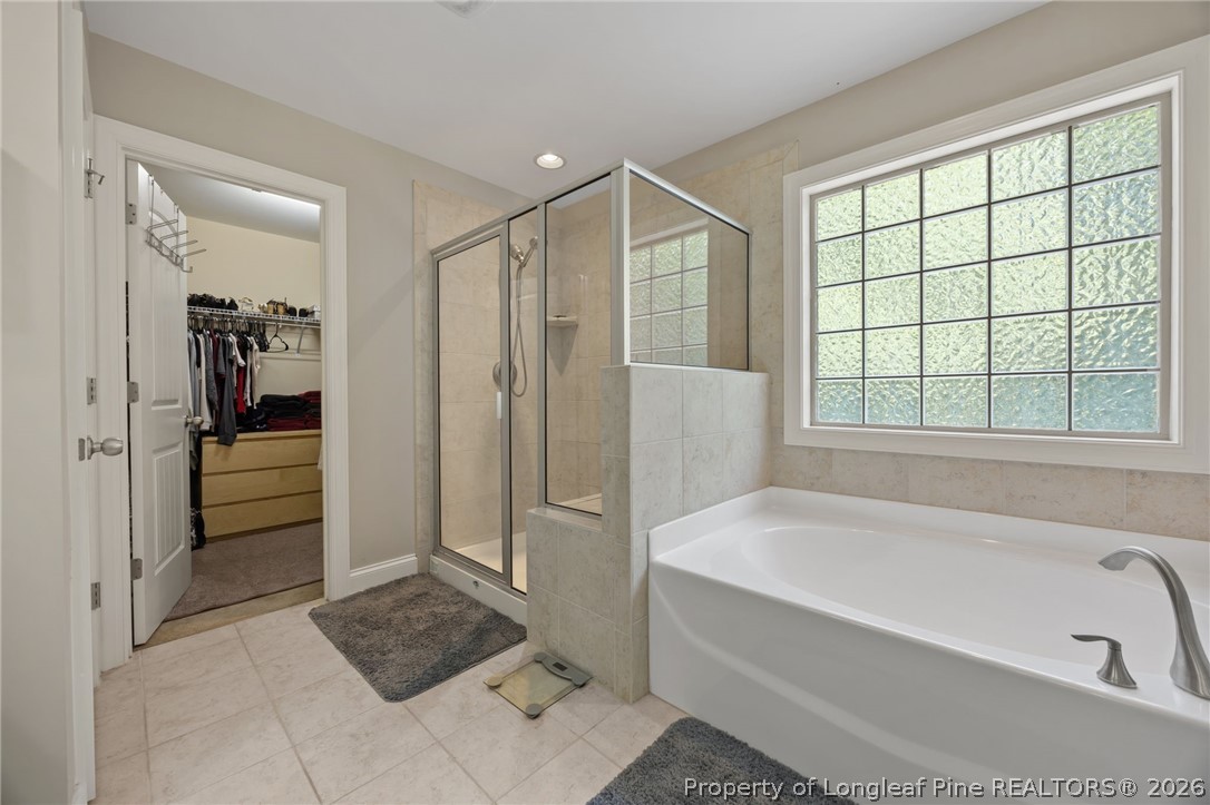 64 Cromwell Circle Cameron, NC 28326 - Photo 25 of 50 a bathroom with a tub shower and sink