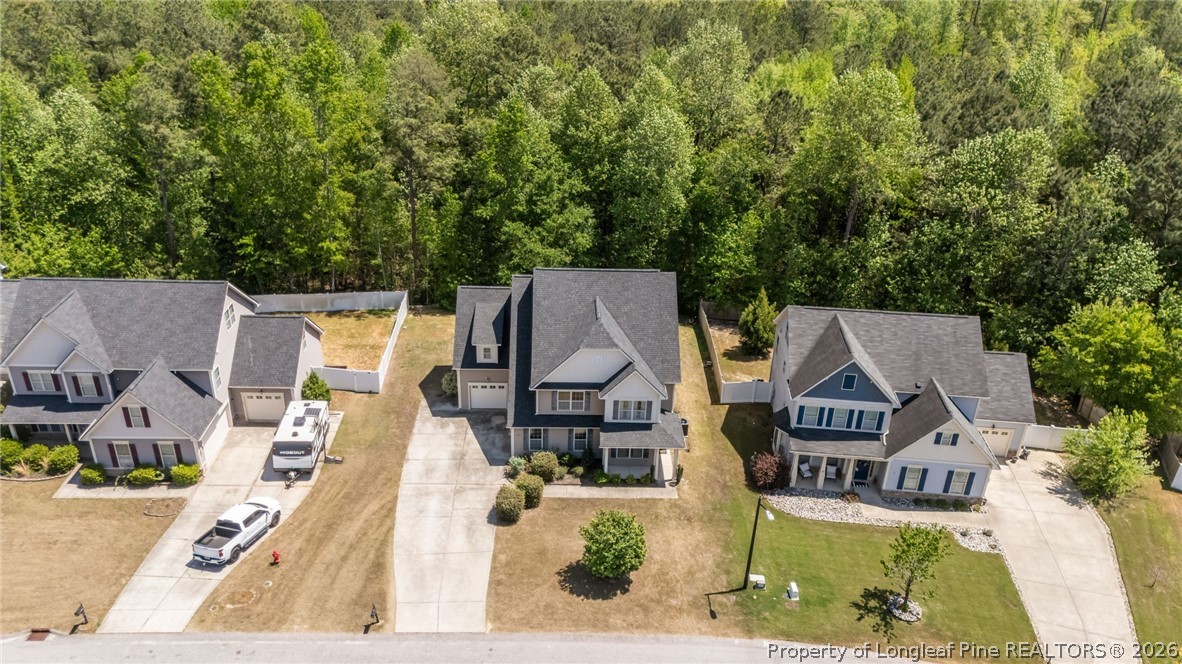 64 Cromwell Circle Cameron, NC 28326 - Photo 47 of 50 an aerial view of a house with swimming pool and large trees
