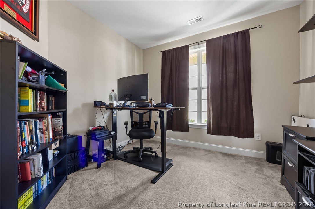 64 Cromwell Circle Cameron, NC 28326 - Photo 10 of 50 a view of a workspace with furniture and a window