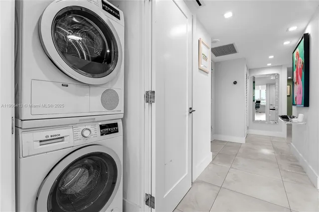 a view of a hallway with washer and dryer