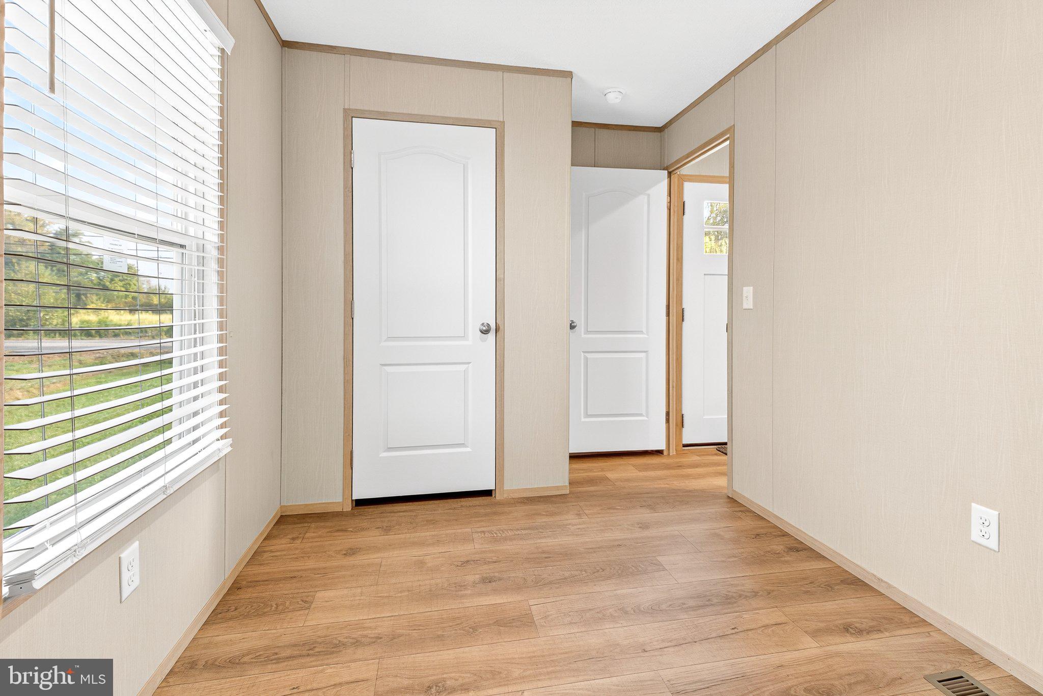 342 Frogtown Road Pequea, PA 17565 - Photo 17 of 37 a view of empty room with wooden floor and fan