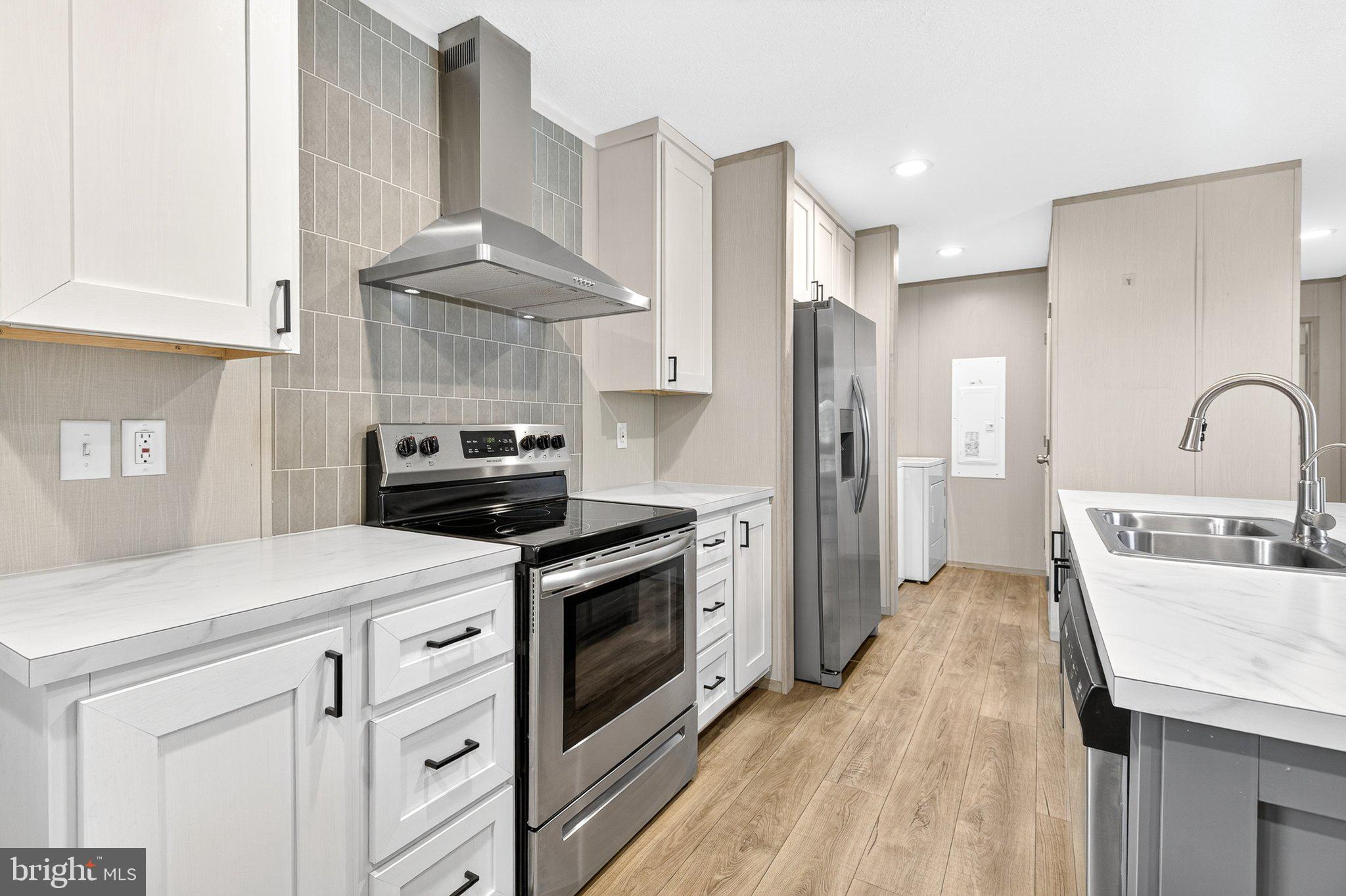 342 Frogtown Road Pequea, PA 17565 - Photo 10 of 37 a kitchen with stainless steel appliances granite countertop a sink stove and refrigerator