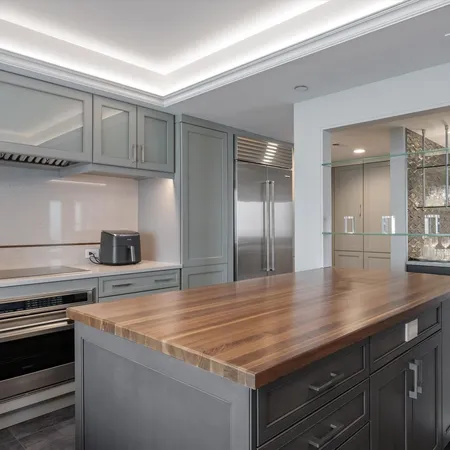 a kitchen with a sink and cabinets