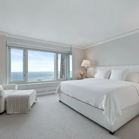 a bedroom with bed and window