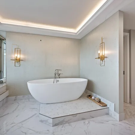 a bathroom with a bathtub and shower