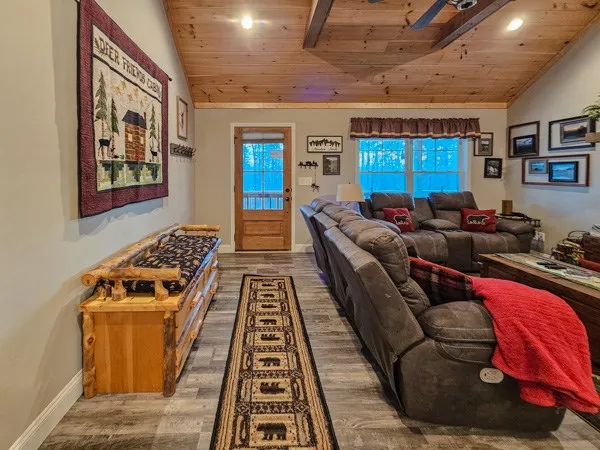 a bedroom with furniture and a rug