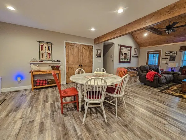 a dining room with furniture and window