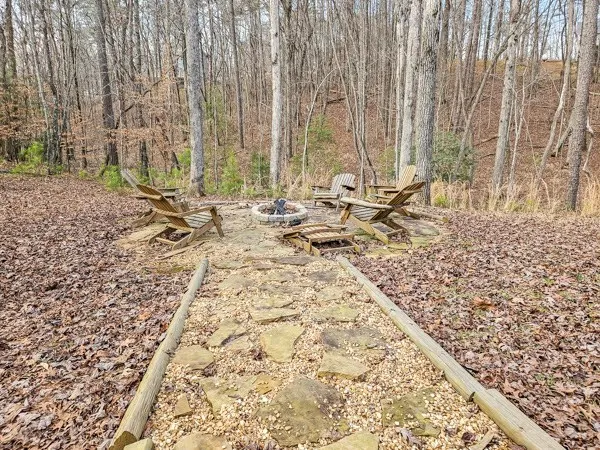 a view of a backyard with table and chairs