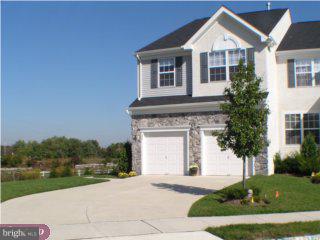 90 Chapel Hill Road Mount Laurel, NJ 08054 - Photo 1 of 6 a front view of a house with a yard and garage