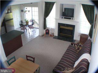 90 Chapel Hill Road Mount Laurel, NJ 08054 - Photo 2 of 6 a living room with furniture a flat screen tv and a fireplace