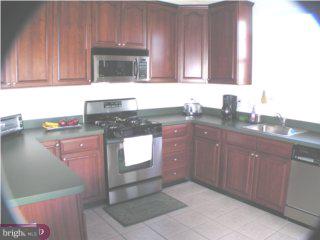 90 Chapel Hill Road Mount Laurel, NJ 08054 - Photo 4 of 6 a kitchen with granite countertop a sink stove and cabinets