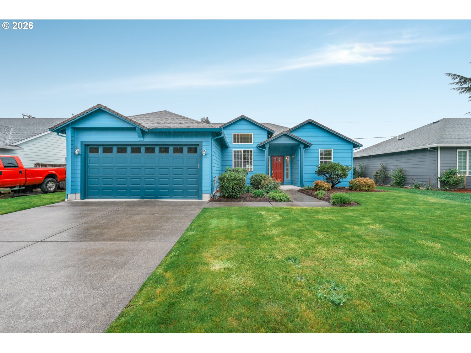 52234 Southeast Tyler Street Scappoose, OR 97056 - Photo 1 of 30 a front view of a house with a yard and garage