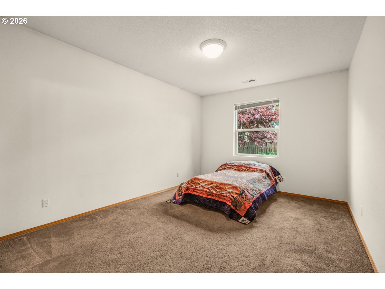 52234 Southeast Tyler Street Scappoose, OR 97056 - Photo 17 of 30 a bedroom with a bed and a wall painting