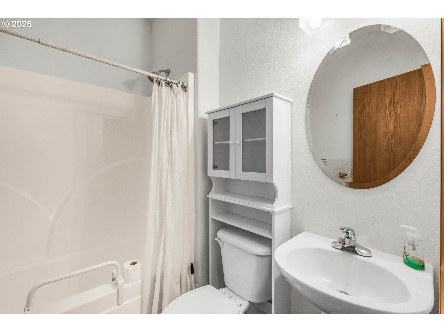 52234 Southeast Tyler Street Scappoose, OR 97056 - Photo 24 of 30 a bathroom with a sink vanity and a mirror