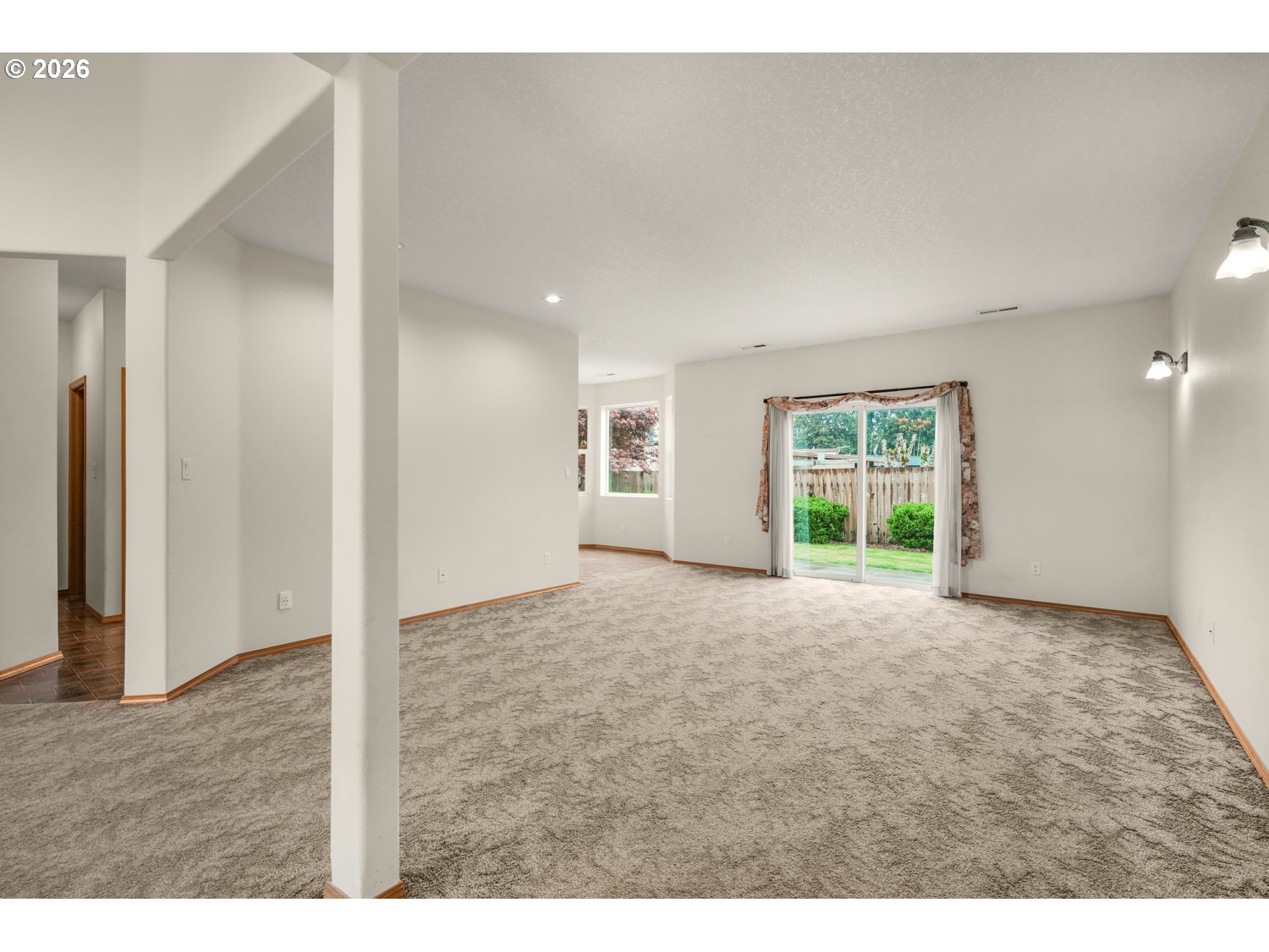 52234 Southeast Tyler Street Scappoose, OR 97056 - Photo 7 of 30 a view of an empty room with a window