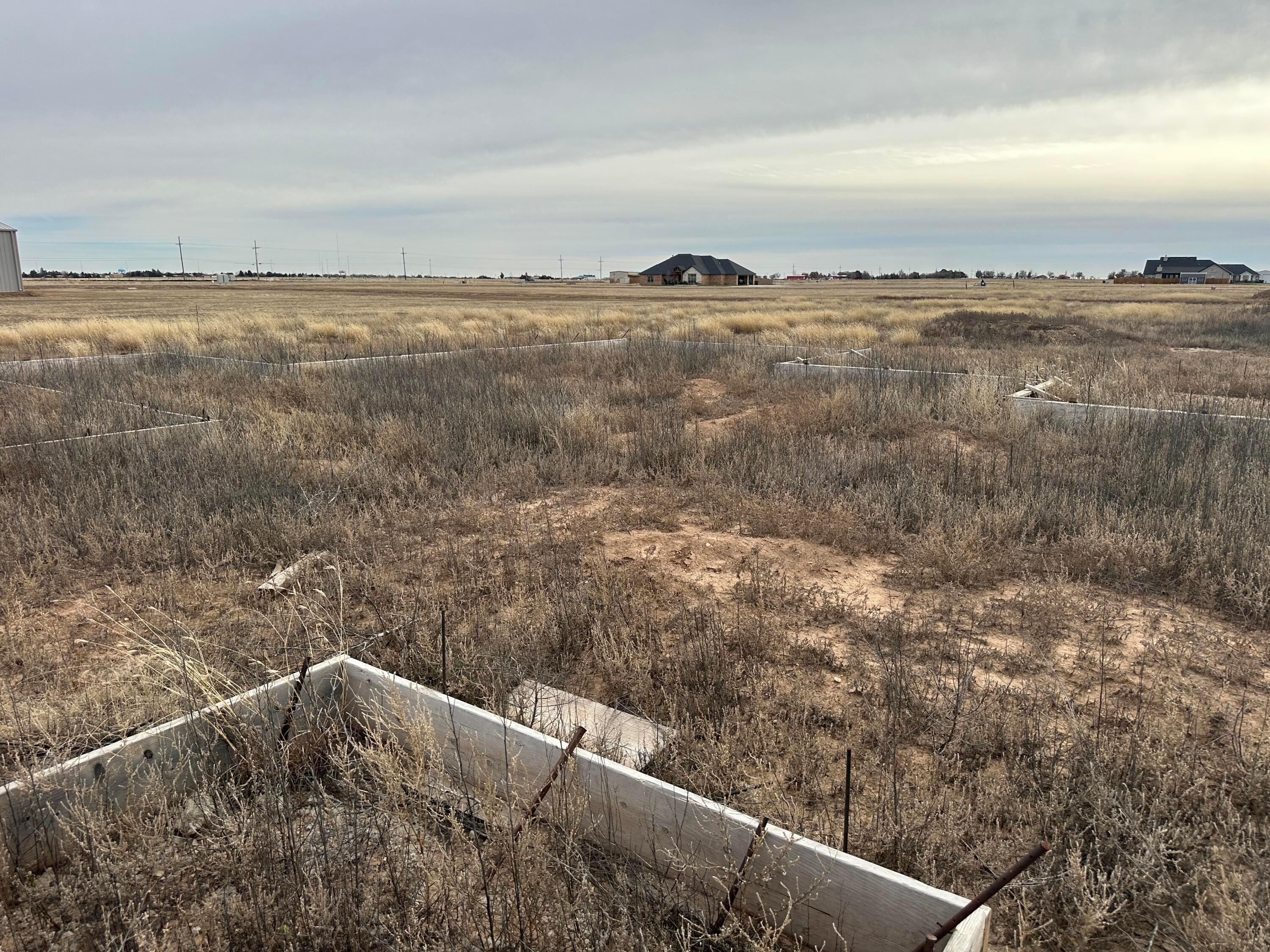 13433 Antenor Road Amarillo, TX 79124 - Photo 4 of 7 a view of a lake from a yard