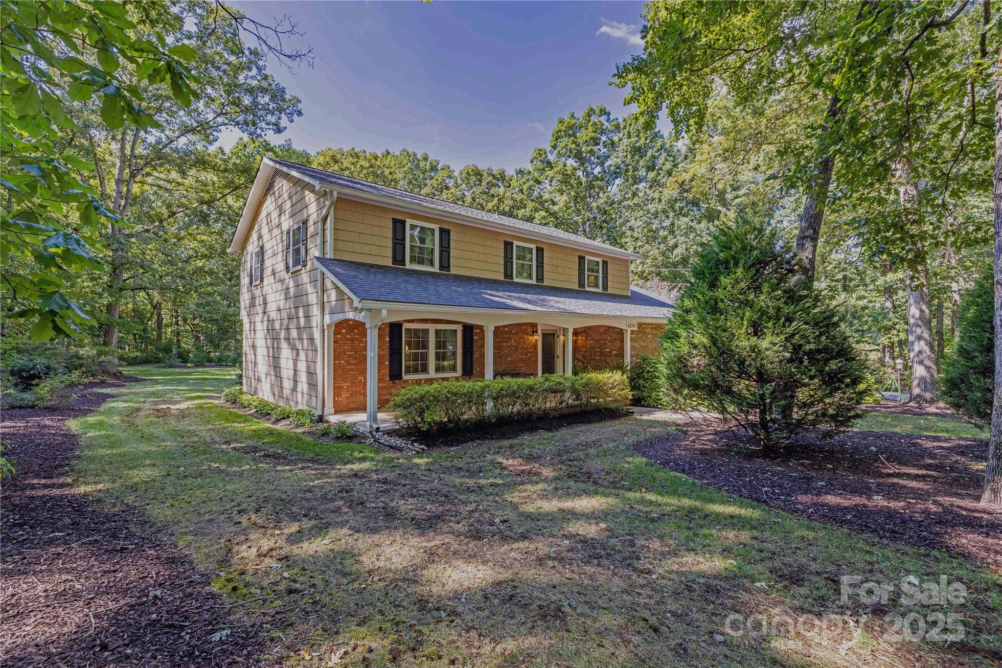 42765 Caudle Road Richfield, NC 28137 - Photo 3 of 37 a view of a yard in front of a house with large trees