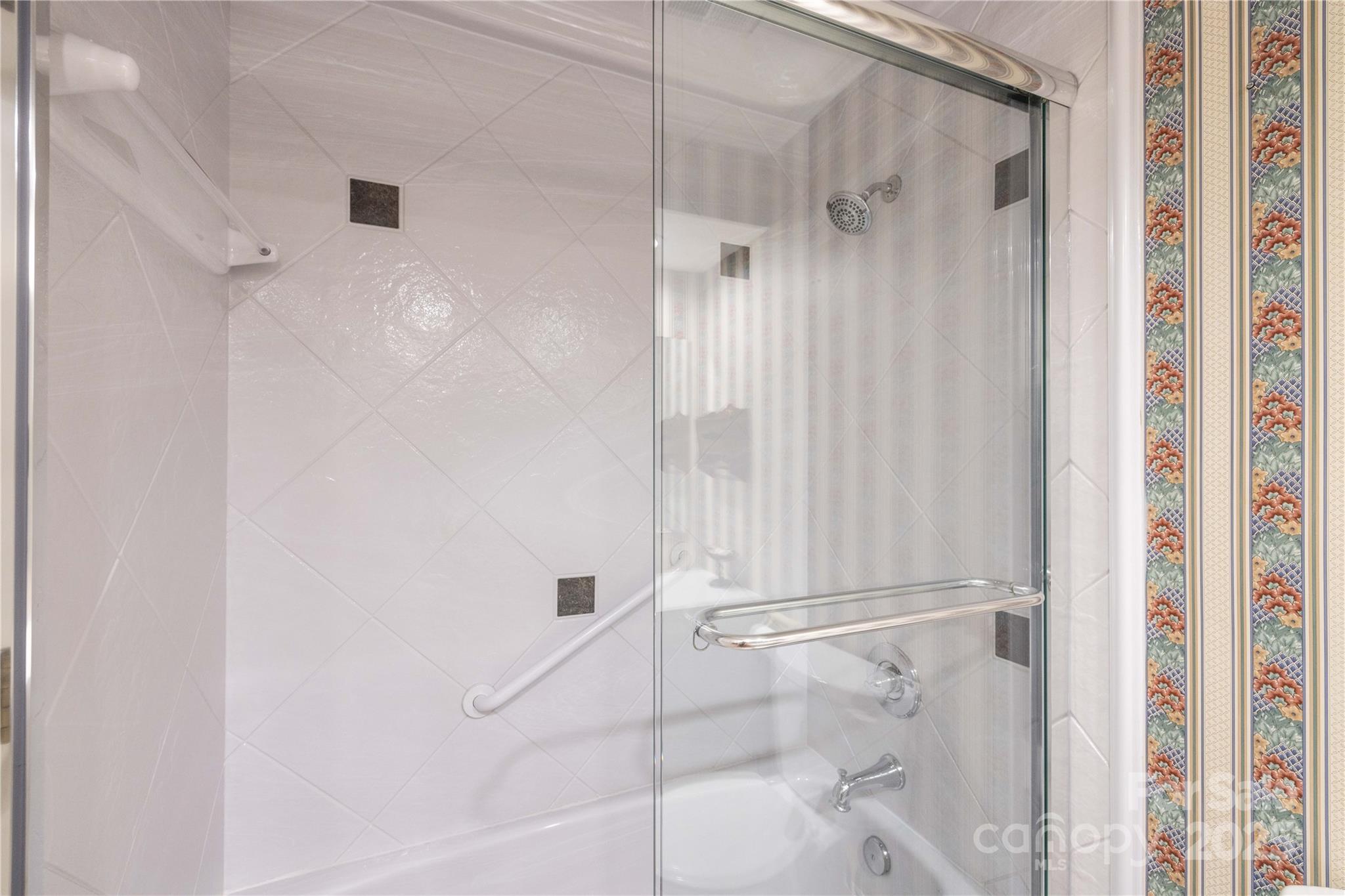 42765 Caudle Road Richfield, NC 28137 - Photo 35 of 37 a bathroom with a glass shower door
