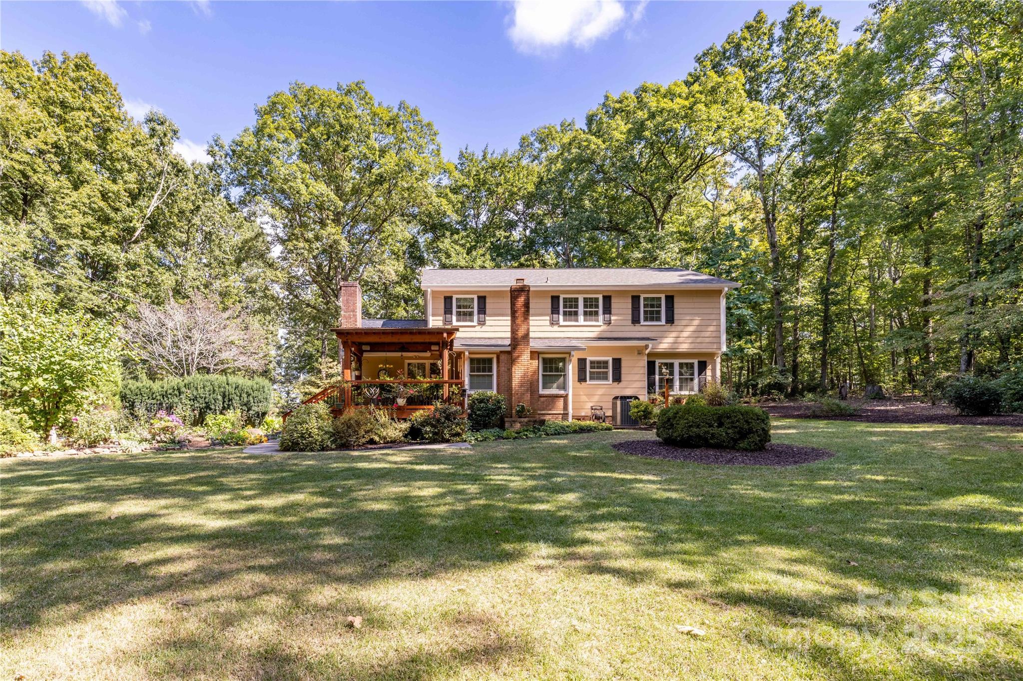42765 Caudle Road Richfield, NC 28137 - Photo 6 of 37 a view of a house with a big yard and large trees