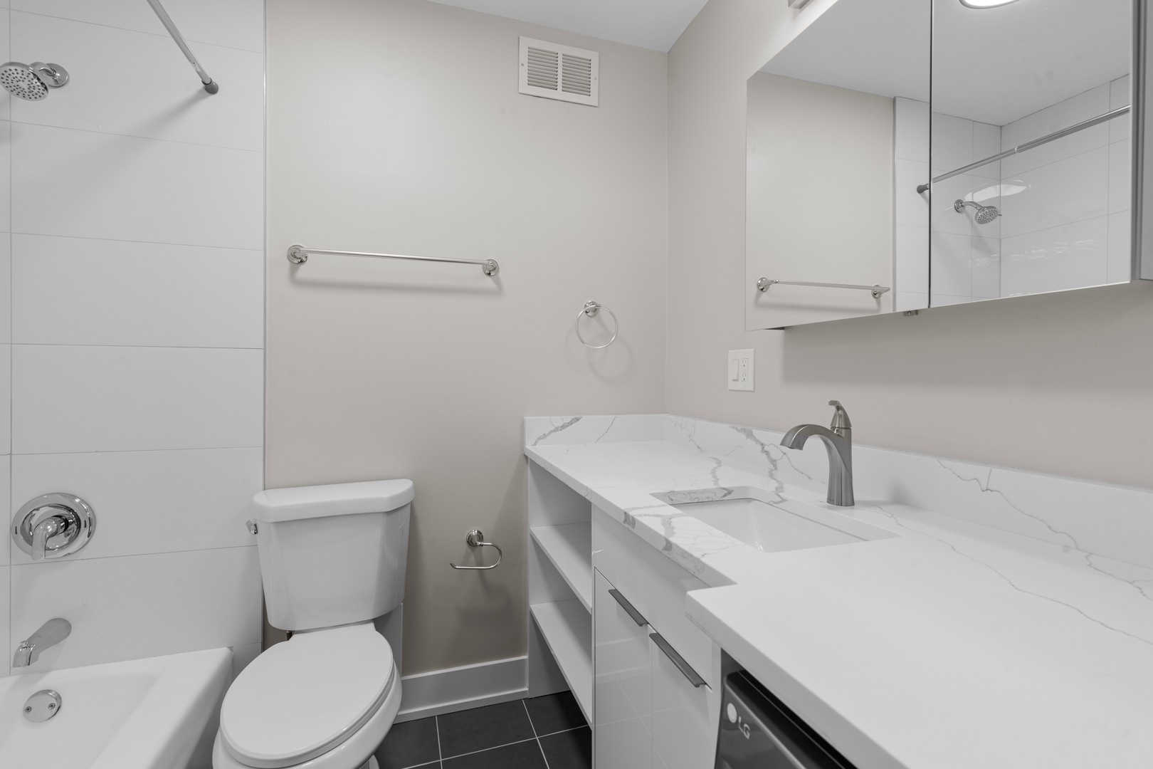 6166 North Sheridan Road, Unit 24B Chicago, IL 60660 - Photo 8 of 17 a bathroom with a sink toilet and vanity