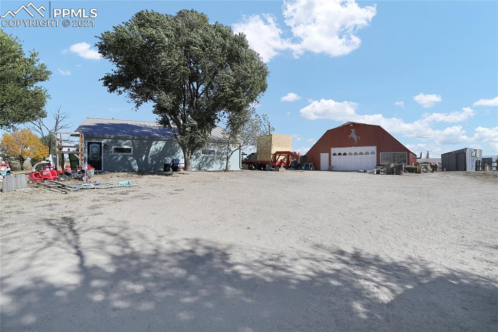 8155 North Log Road Peyton, CO 80831 - Photo 1 of 29 a view of a street with a building in the background