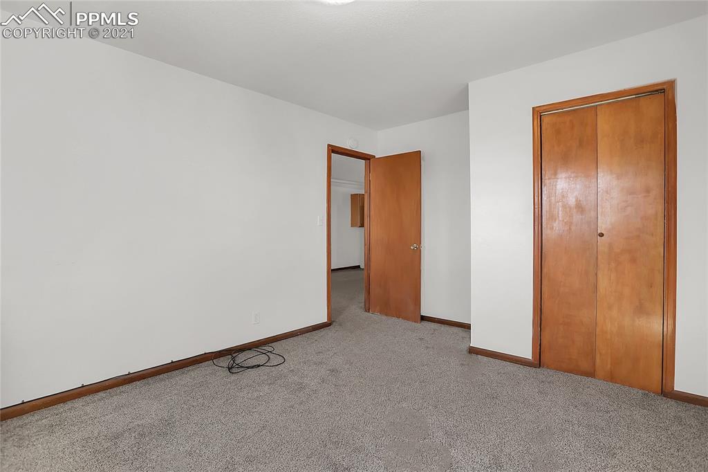 8155 North Log Road Peyton, CO 80831 - Photo 18 of 29 an empty room with closet area