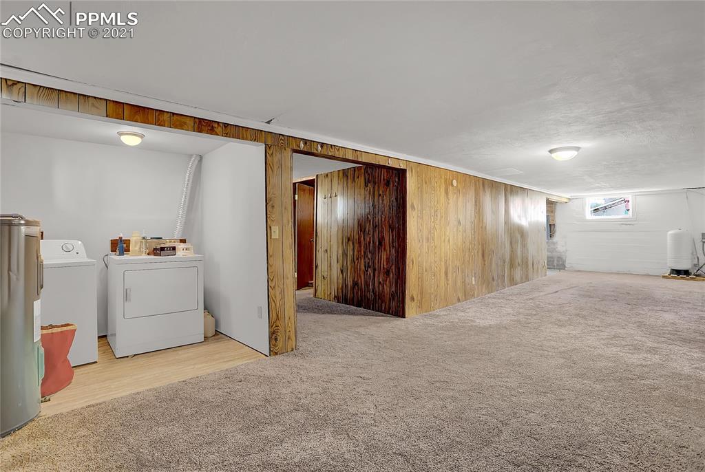 8155 North Log Road Peyton, CO 80831 - Photo 21 of 29 a view of a storage & utility room with closet dryer