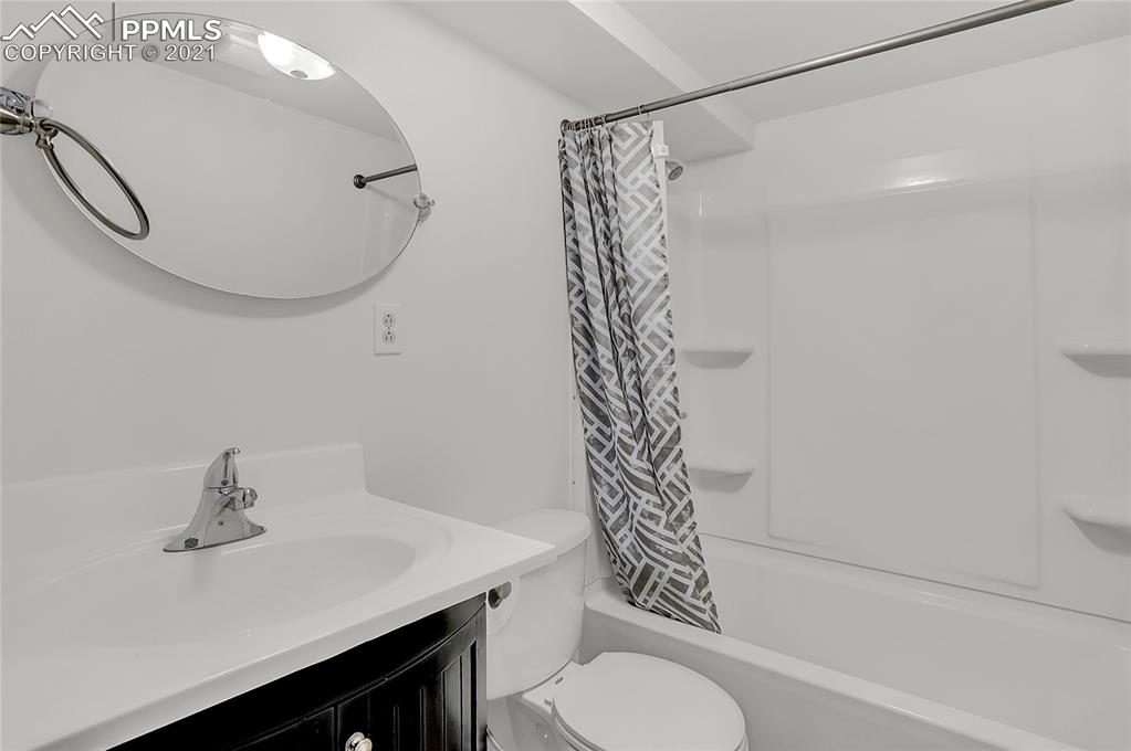 8155 North Log Road Peyton, CO 80831 - Photo 23 of 29 a bathroom with a sink toilet and shower