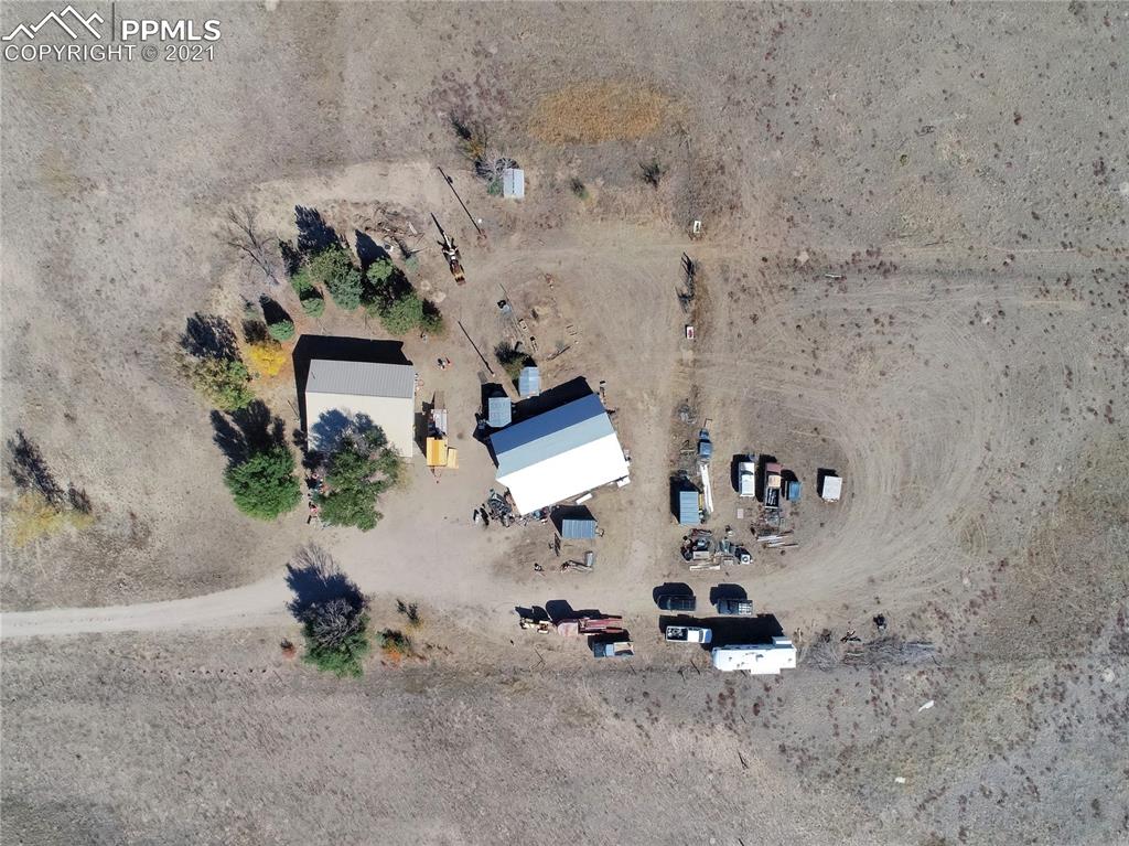 8155 North Log Road Peyton, CO 80831 - Photo 29 of 29 an aerial view of a fireplace with wooden floor