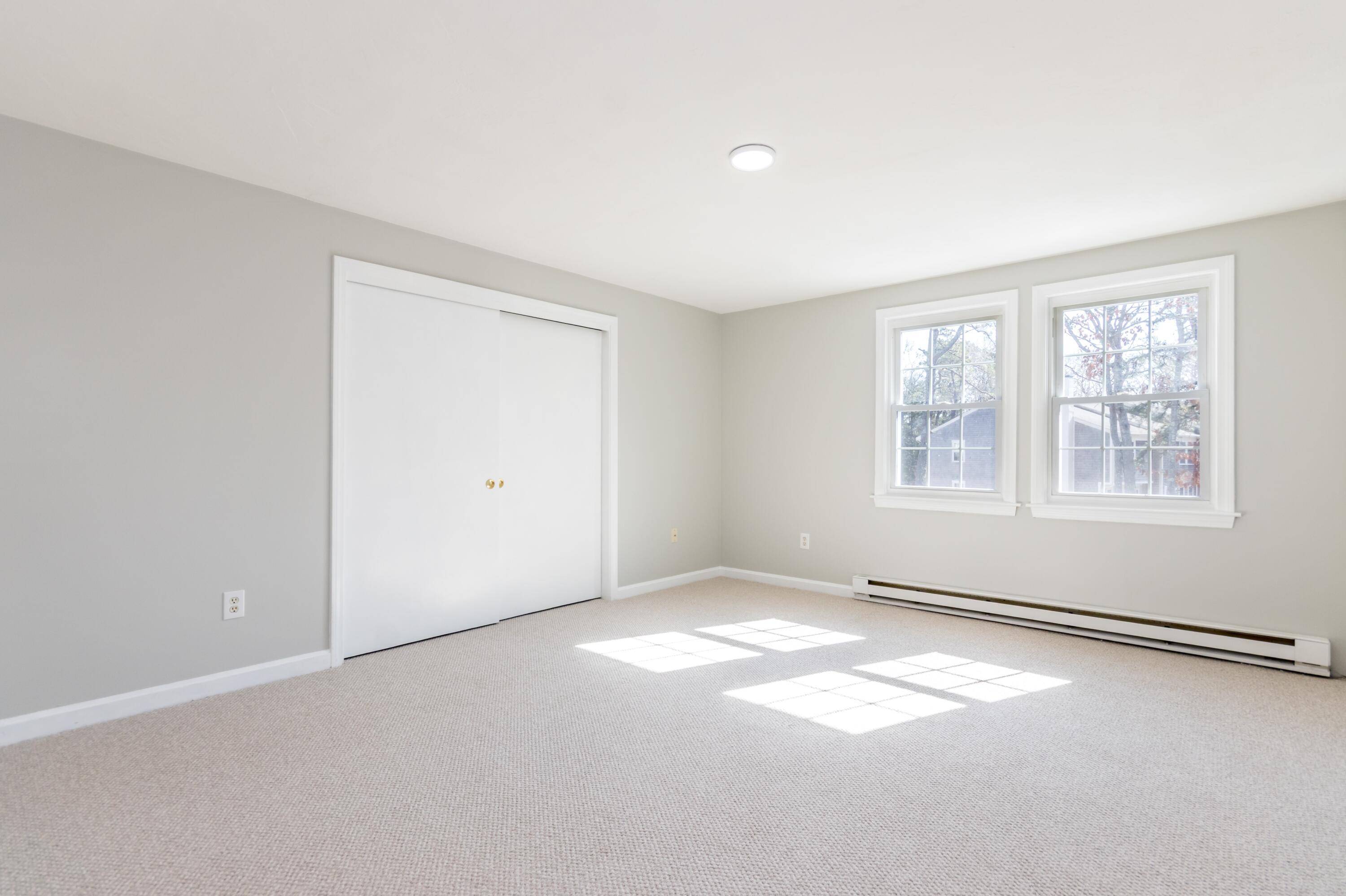 300 Falmouth Road, Unit 16A Mashpee, MA 02649 - Photo 15 of 25 an empty room with windows