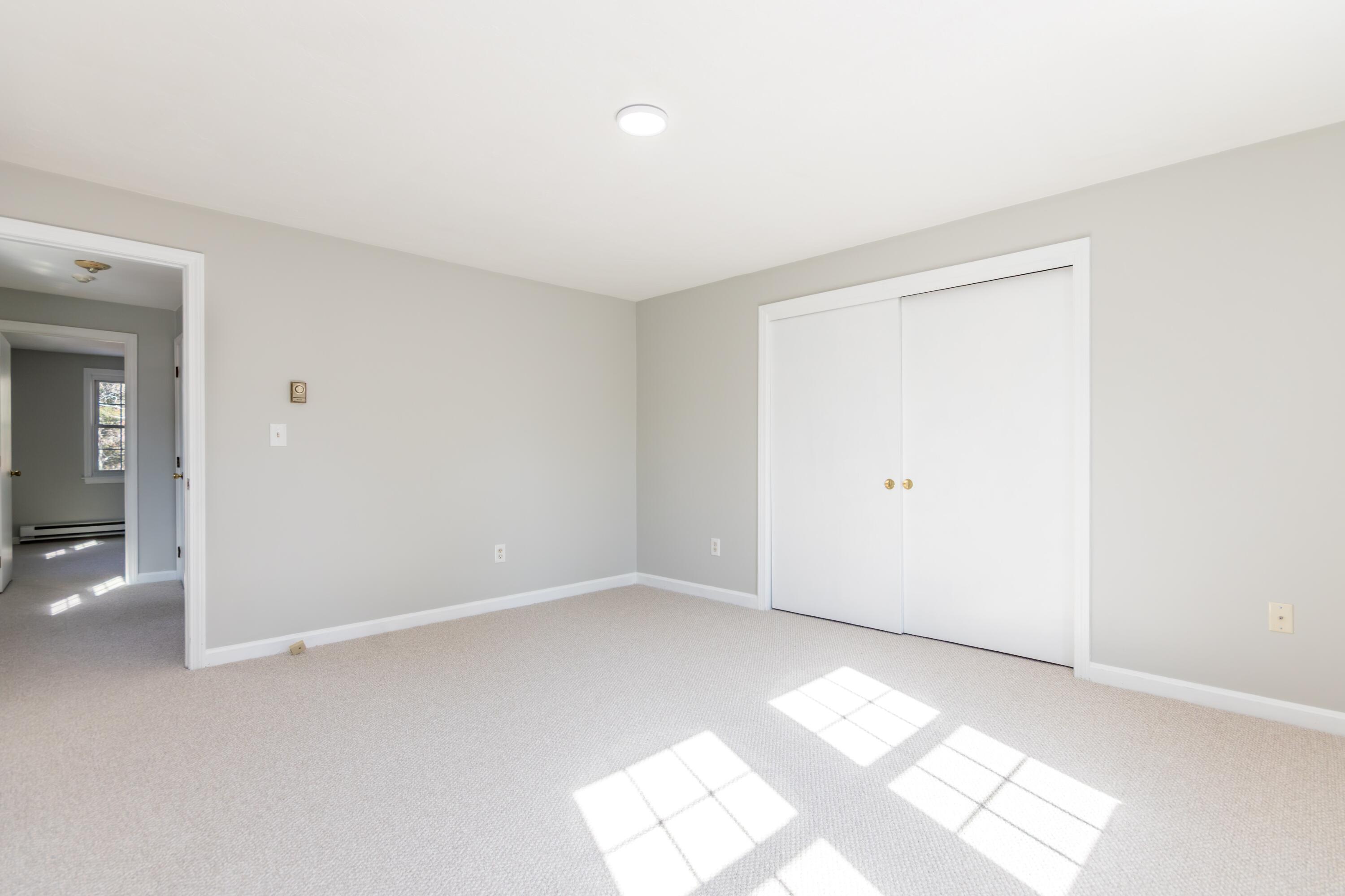 300 Falmouth Road, Unit 16A Mashpee, MA 02649 - Photo 17 of 25 an empty room with windows
