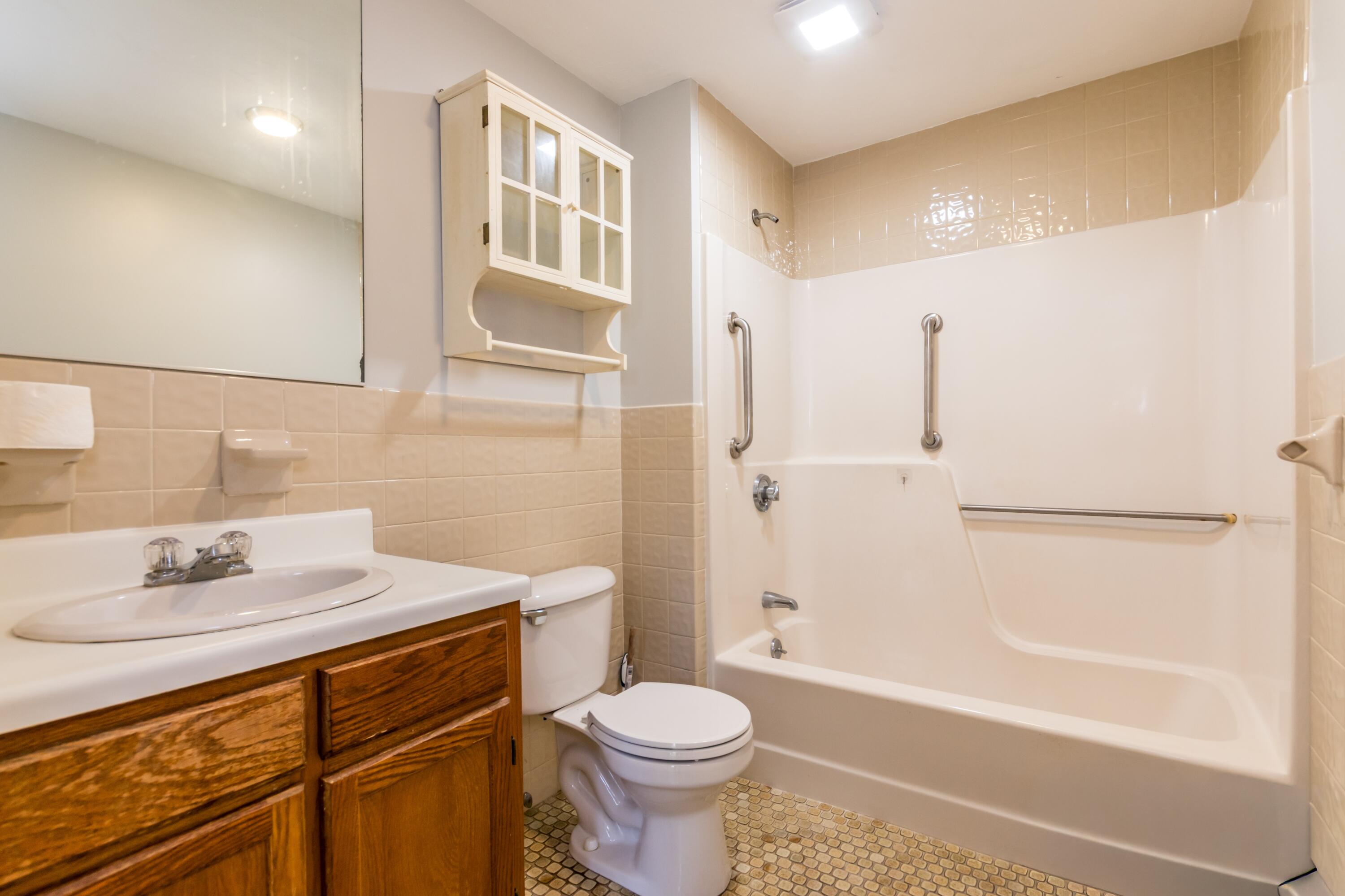 300 Falmouth Road, Unit 16A Mashpee, MA 02649 - Photo 20 of 25 a bathroom with a sink toilet and shower