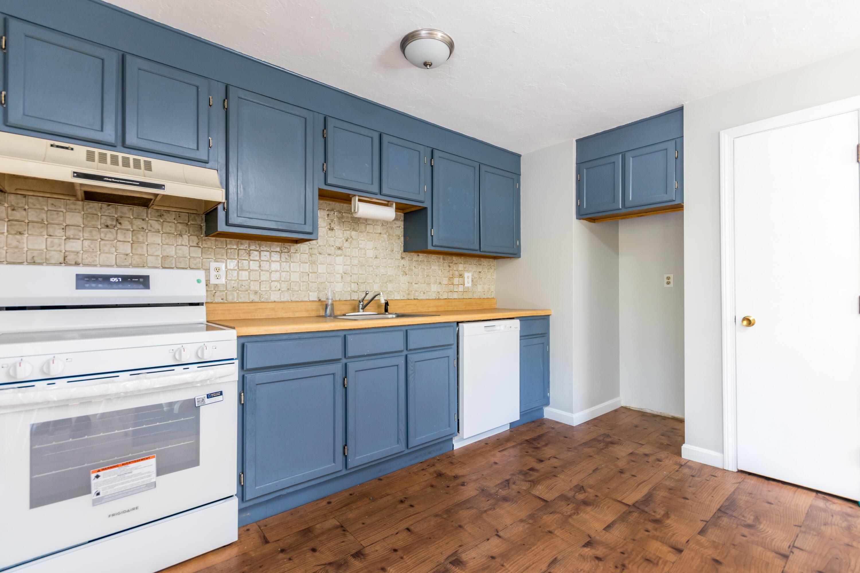 300 Falmouth Road, Unit 16A Mashpee, MA 02649 - Photo 10 of 25 a kitchen with stainless steel appliances granite countertop a refrigerator sink and cabinets