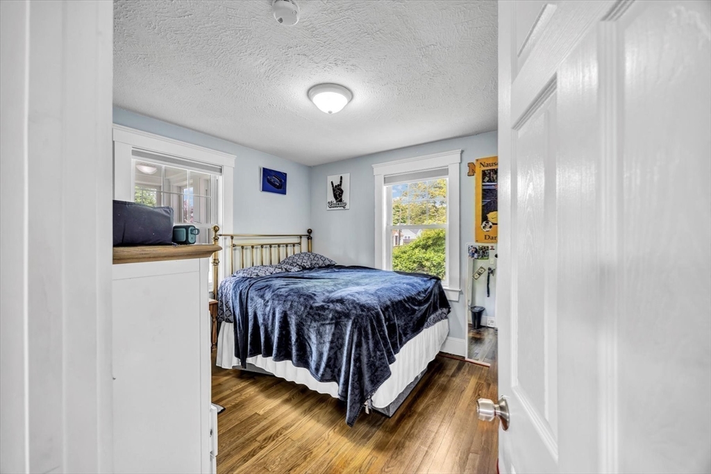 60 Grove Street Barnstable, MA 02601 - Photo 17 of 34 a spacious bedroom with a bed and a dresser