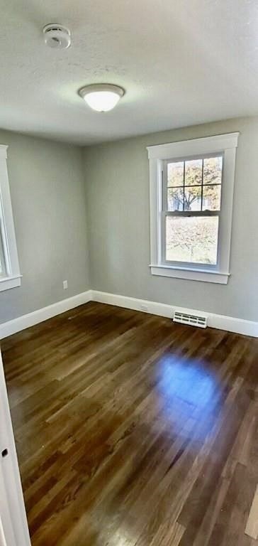 60 Grove Street Barnstable, MA 02601 - Photo 18 of 34 an empty room with wooden floor and windows