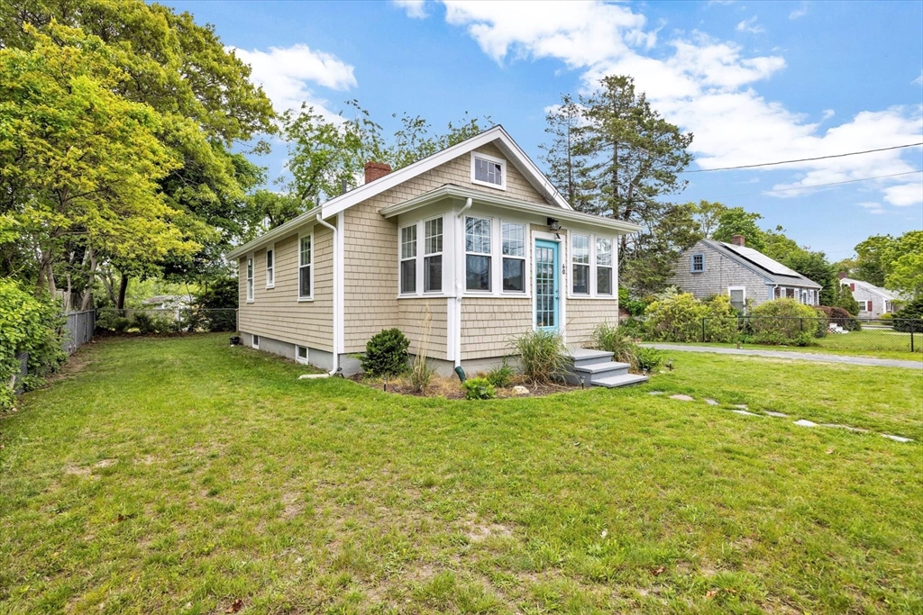 60 Grove Street Barnstable, MA 02601 - Photo 2 of 34 a front view of house with yard and green space