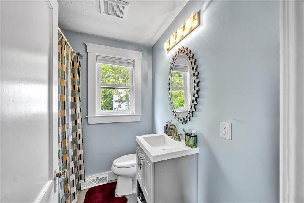 60 Grove Street Barnstable, MA 02601 - Photo 23 of 34 a bathroom with a toilet sink and mirror