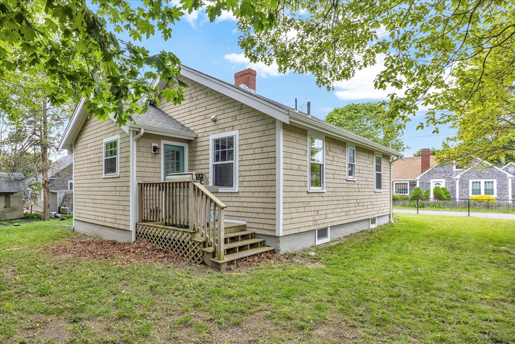 60 Grove Street Barnstable, MA 02601 - Photo 3 of 34 a view of a house with a yard