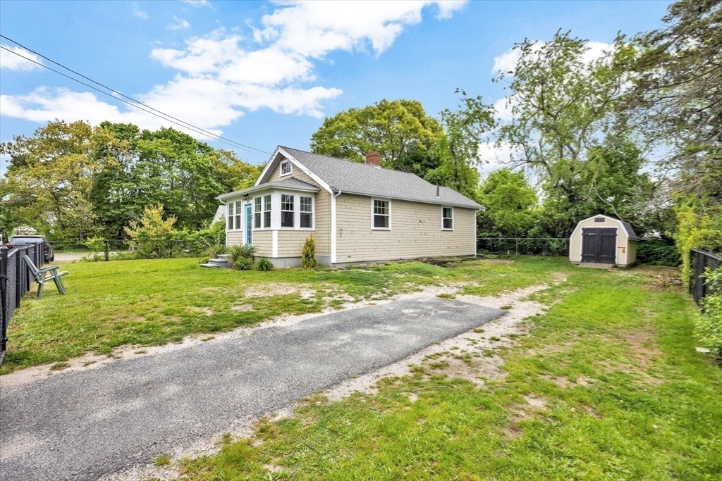 60 Grove Street Barnstable, MA 02601 - Photo 31 of 34 a front view of house with yard and green space