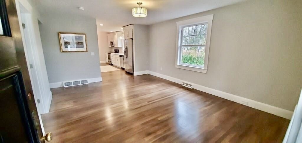 60 Grove Street Barnstable, MA 02601 - Photo 6 of 34 wooden floor in an empty room with a window