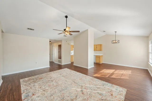 a view of a livingroom with a kitchen
