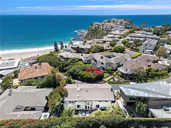 an aerial view of a house with a ocean view