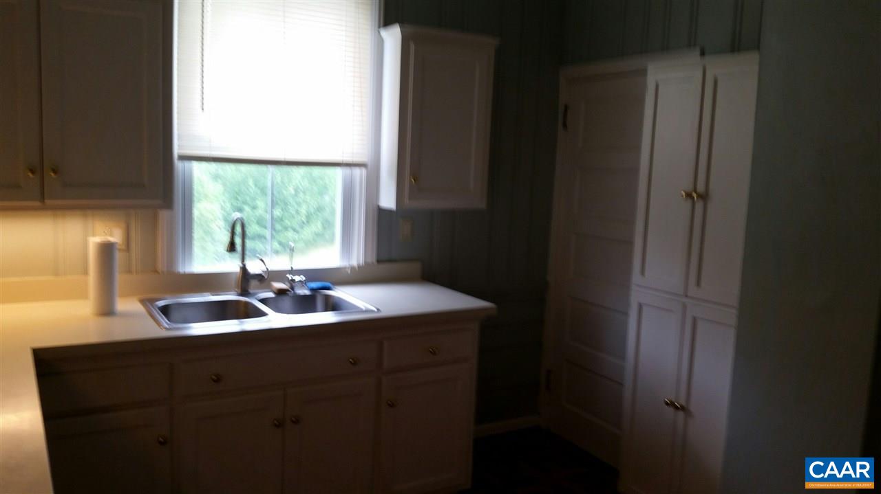 300 Schoolhouse Road Madison, VA 22727 - Photo 8 of 22 a bathroom with a sink and a window