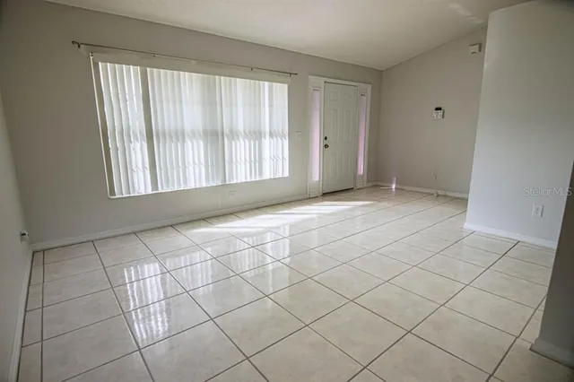 a view of an empty room and window