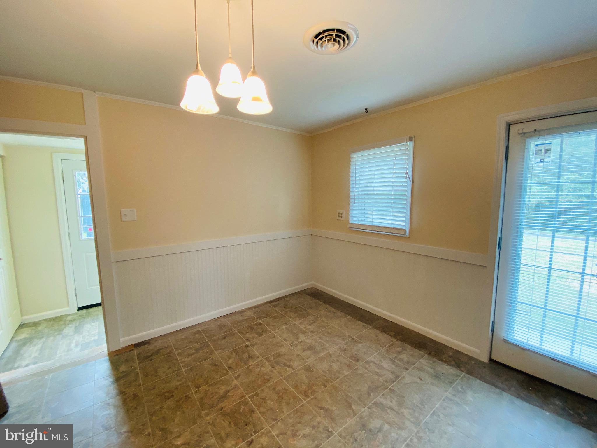 1054 Jordan Springs Road Stephenson, VA 22656 - Photo 3 of 32 Kitchen table space with wainscoting